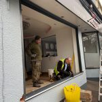 action shot of shopfront window fittting - belfry Windows