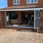 bifold door fitting progress - belfry Windows