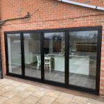 black bi folds doors garden view - belfry Windows