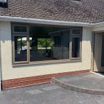 brown front door and window fitting- belfry Windows