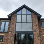 front view of full installtion of grand window and door - belfry Windows