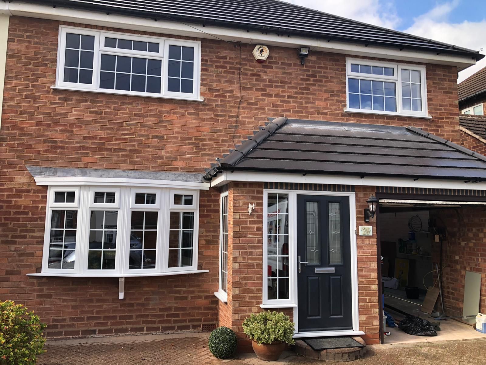 front view of home with newly fitted foor and windows - belfry Windows